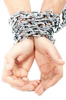 Hands chained in a chain