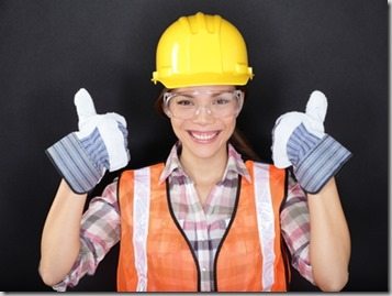 Construction worker thumbs up happy woman portrait
