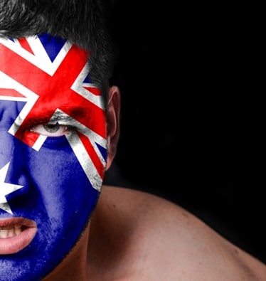 Portrait of angry man with painted flag of Australia